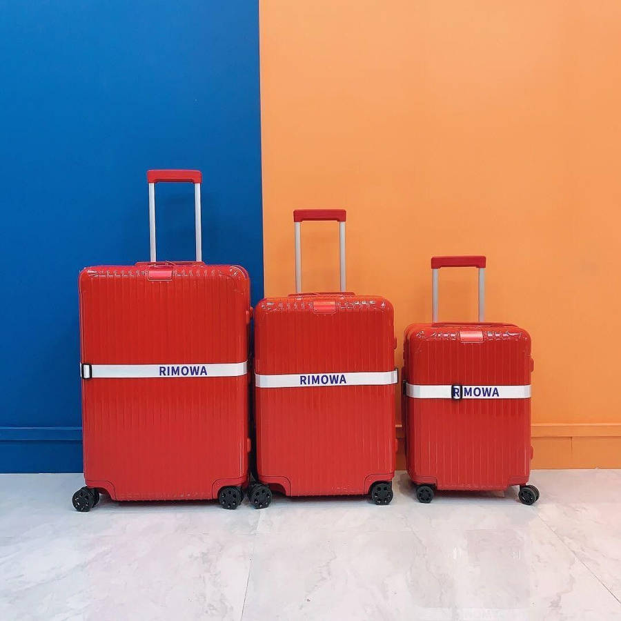 Three Flamingo Red Rimowa Luggage Wallpaper