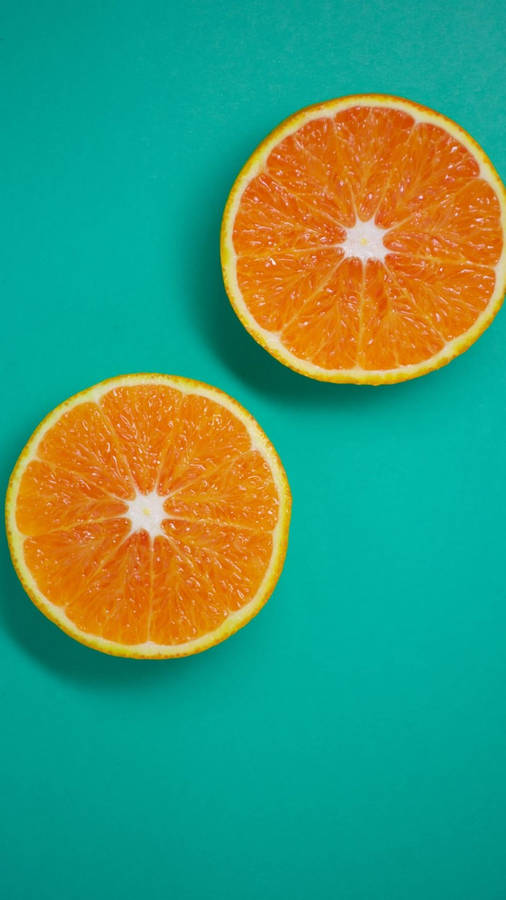 Three Sliced Orange Fruits Wallpaper