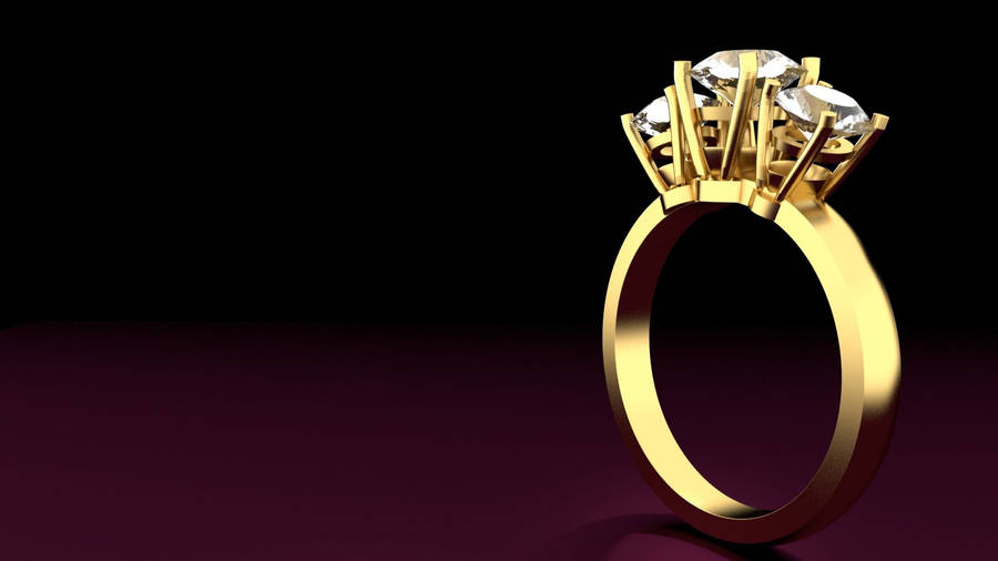 Three Stone Gold Ring Wallpaper