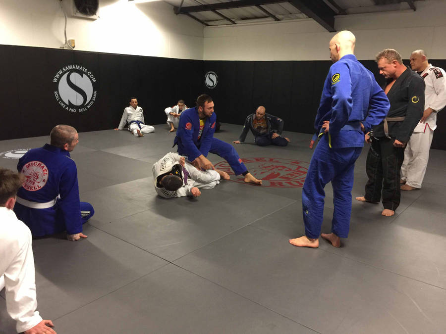 Thrill Of A Challenge - Engaging In Brazilian Jiu-jitsu In A Modern Studio Wallpaper