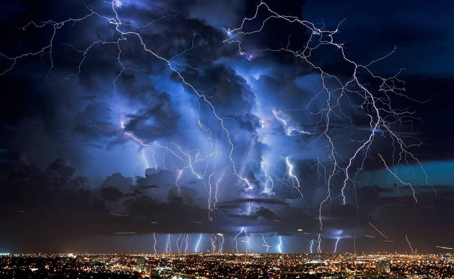 Thunderstorm Over Bright City Wallpaper