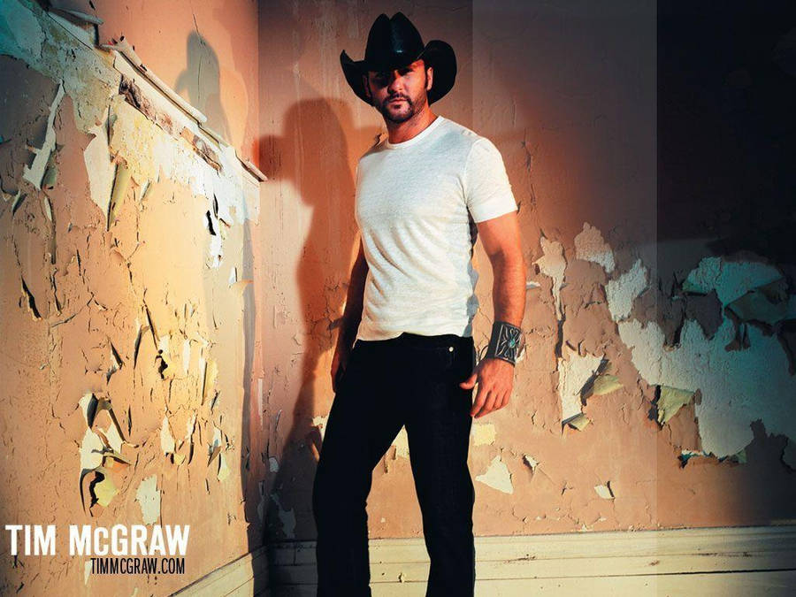 Tim Mcgraw Near Grungy Wall Wallpaper