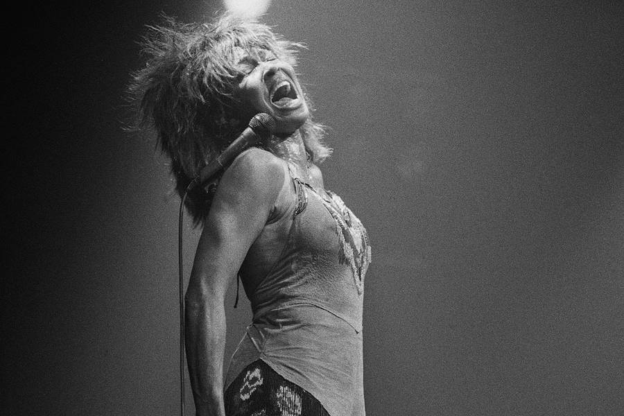 Tina Turner 1980s Iconic Performance Wallpaper