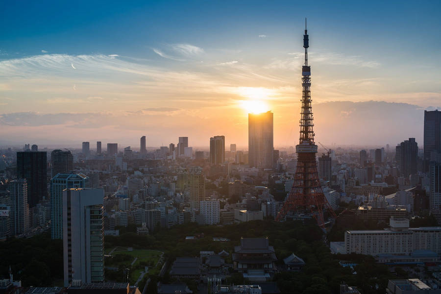 Tokyo Tower Sun Peeking Through Clouds Wallpaper