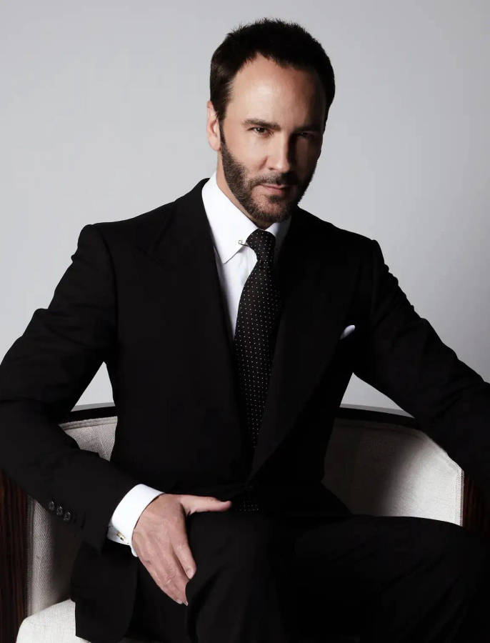 Tom Ford Posing On Chair Wallpaper