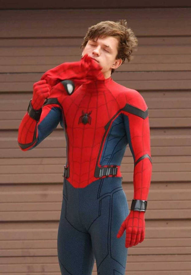 Tom Holland In Character At A Movie Set Wallpaper