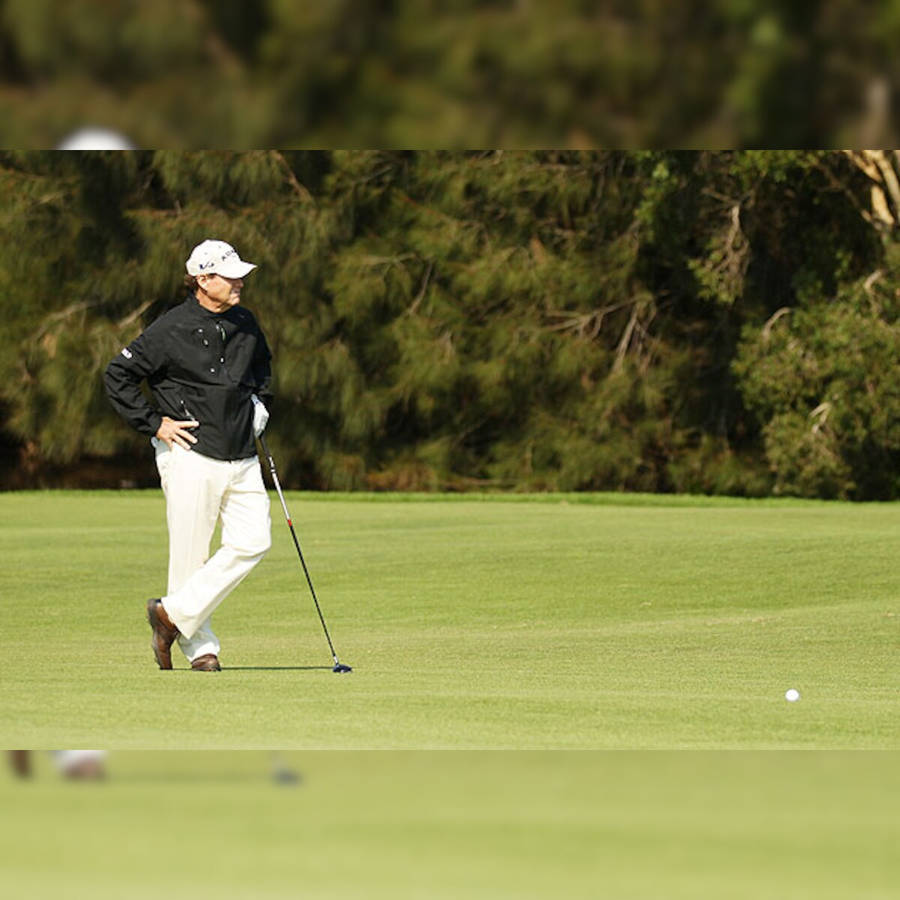 Tom Watson Deep In Thought On The Golf Course Wallpaper