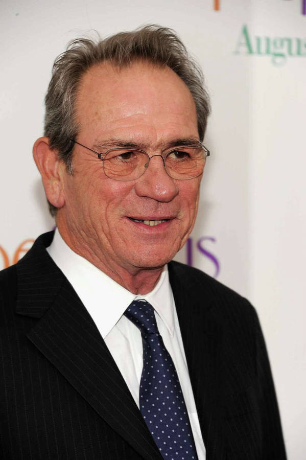 Tommy Lee Jones In Striped Coat And Polka Dot Necktie Wallpaper