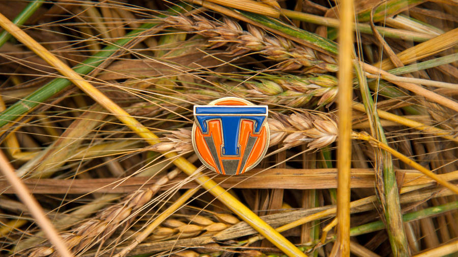 Tomorrowland Movie Emblem On Haystack Wallpaper