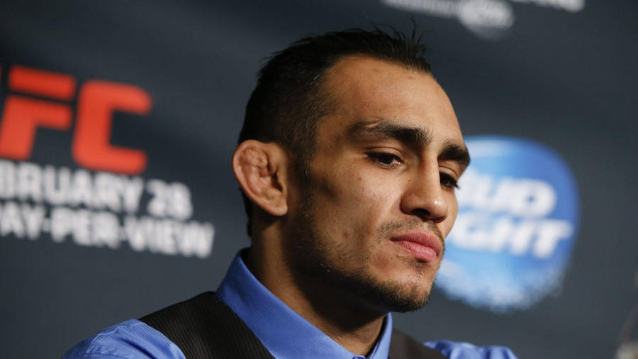 Tony Ferguson Confidently Speaking At A Press Conference Wallpaper