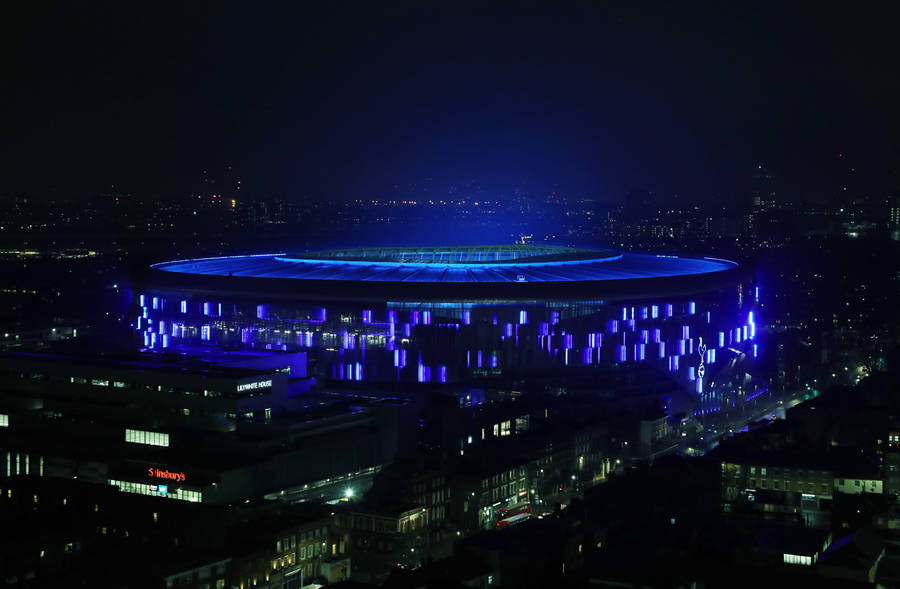 Tottenham Hotspurs Fc Stadium With Blue Lights Wallpaper