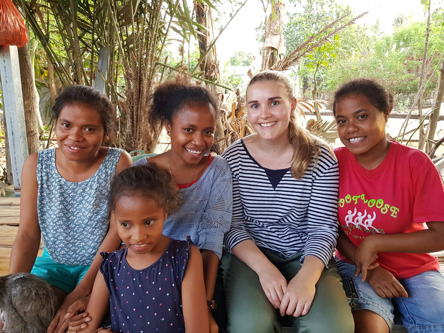 Tourist Interacting With Locals In Timor-leste Wallpaper