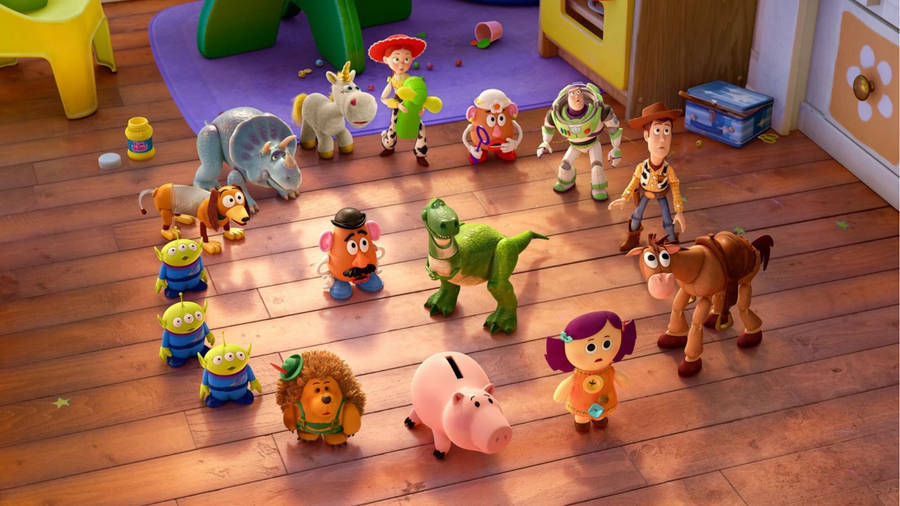 Toy Story Rex Surrounded By Friends Wallpaper