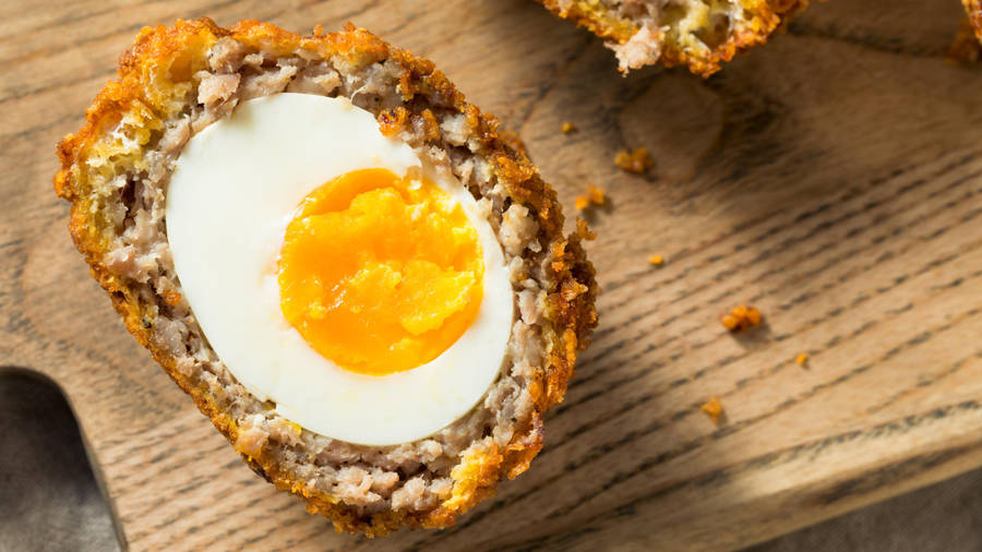 Traditional British Scotch Egg Dish In Half Slice Wallpaper