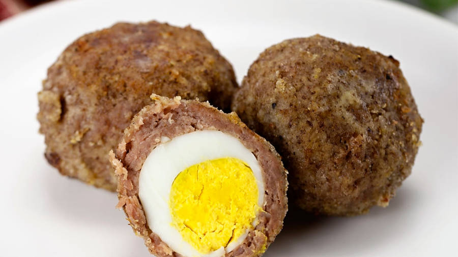 Traditional British Scotch Eggs Dish Half Slice Wallpaper