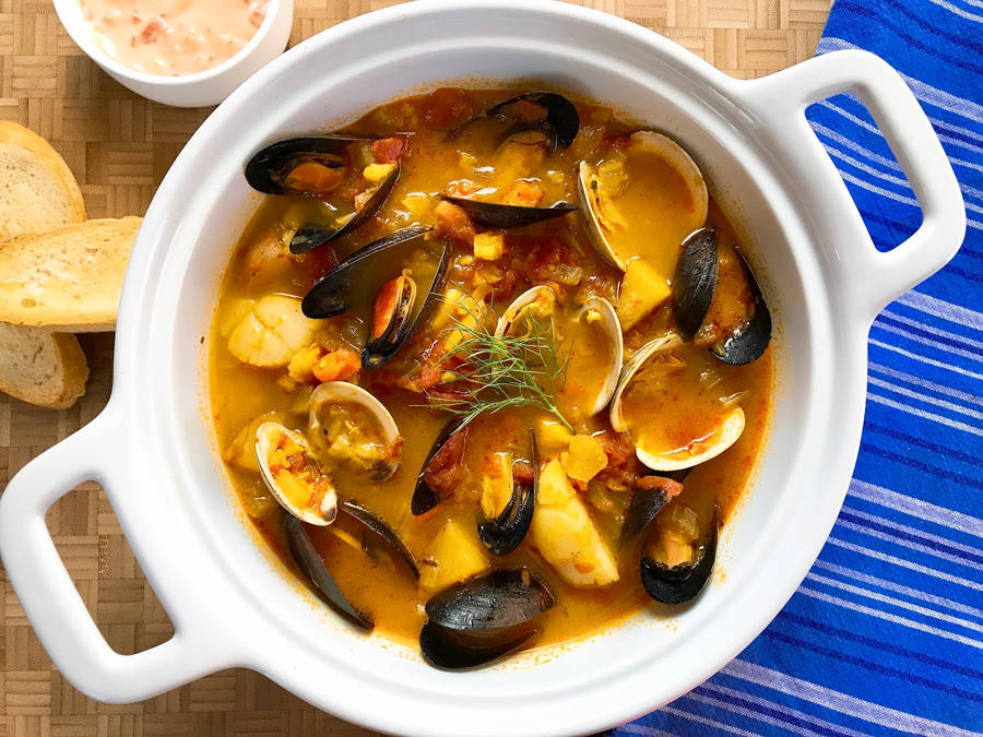 Traditional French Bouillabaisse Served With Crusty Bread Wallpaper