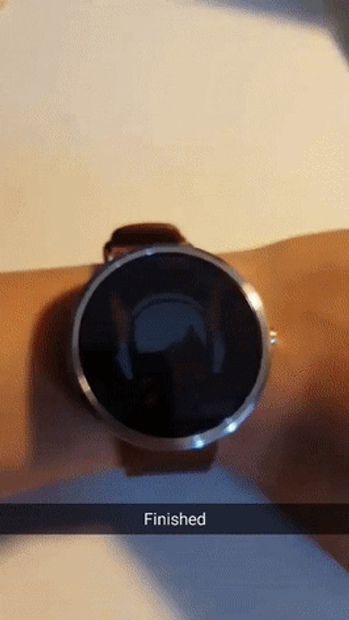 Trendy Smartwatch On Wooden Surface Wallpaper