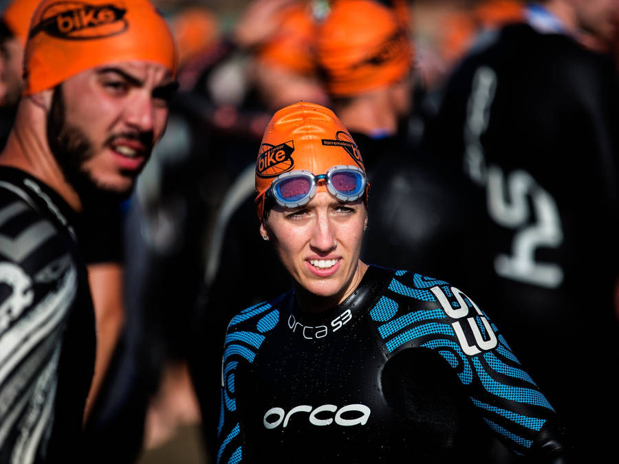 Triathlon Athlete Wearing Orca Brand Wallpaper