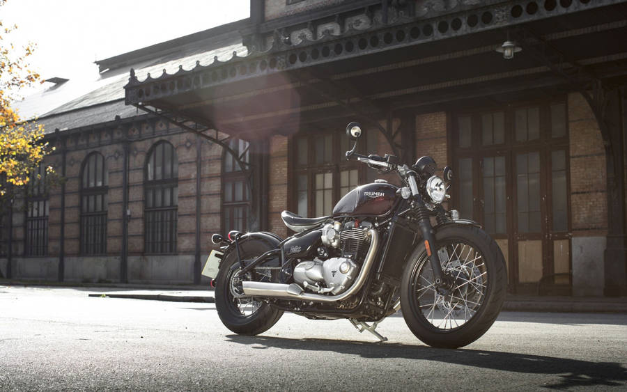 Triumph Bonneville Bobber In Vintage Setting Wallpaper