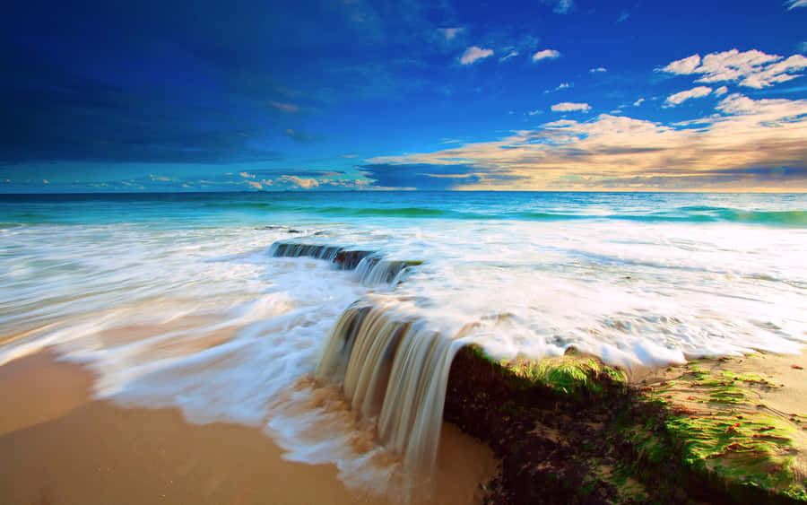 Tropical Beach Paradise With Waterfall Wallpaper