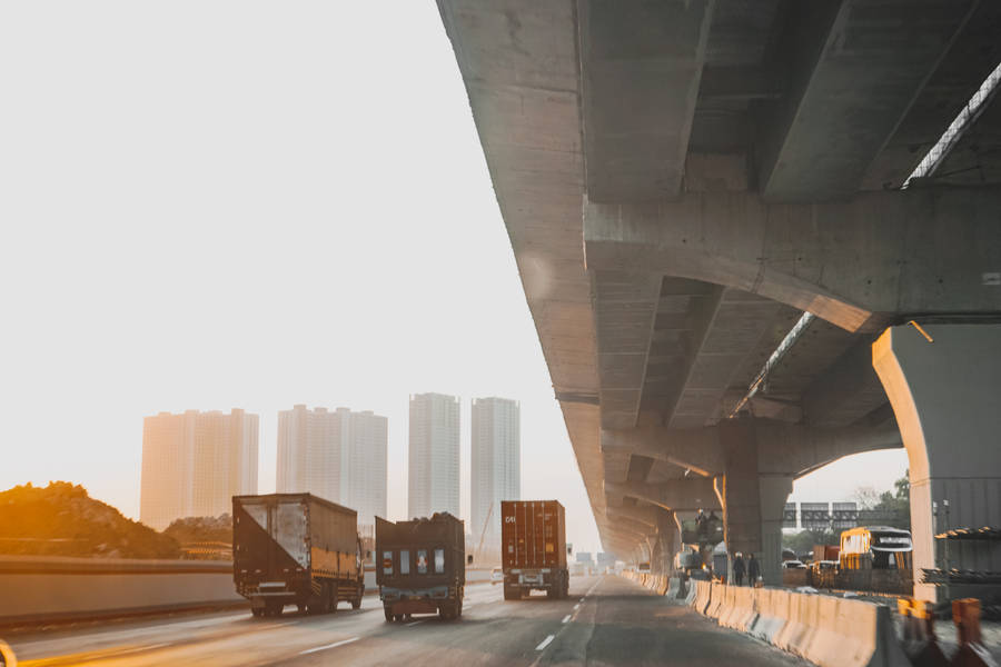 Trucks Highway Near Jakarta Metropolis Wallpaper