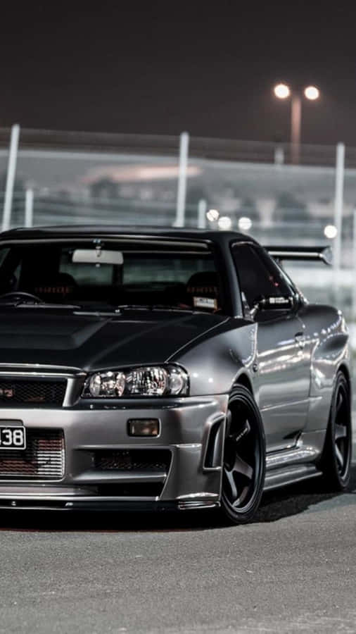 Turn Heads In The Sleek And Powerful Nissan Skyline. Wallpaper