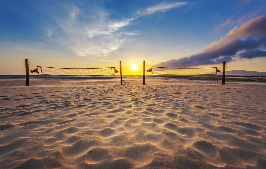 Two Beach Volleyball Nets At Sunrise Wallpaper