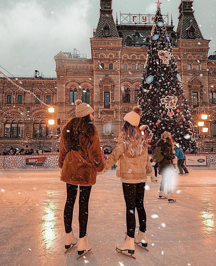 Two Best Friends Skating At Christmas Wallpaper