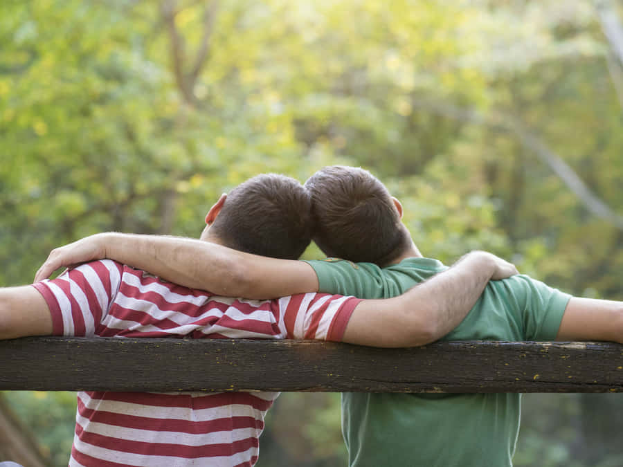 Two Gay Boys Leaning On Each Other Wallpaper