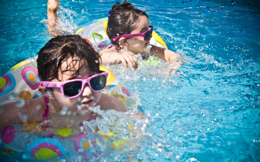 Two Little Girls In Swimming Pool Wallpaper