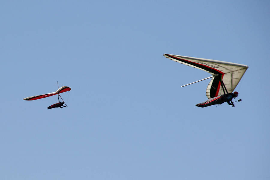 Two Men Hang Gliding Sports Adventure Wallpaper