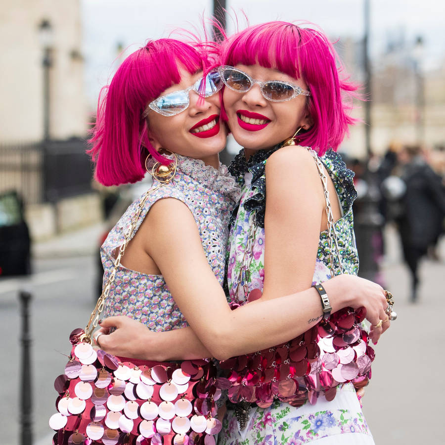 Two Women With Magenta Hair Up-close Wallpaper