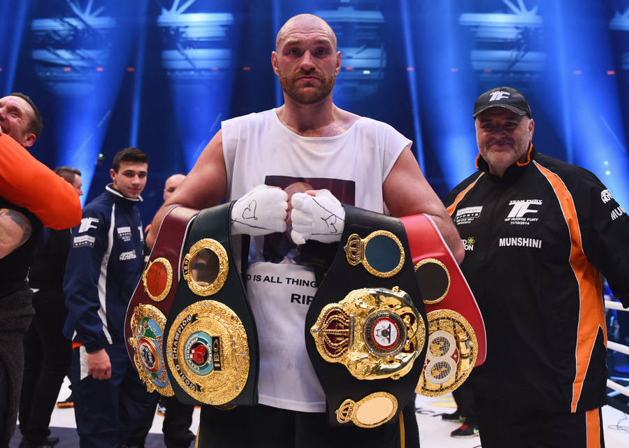 Tyson Fury Displays His Boxing Belts Wallpaper