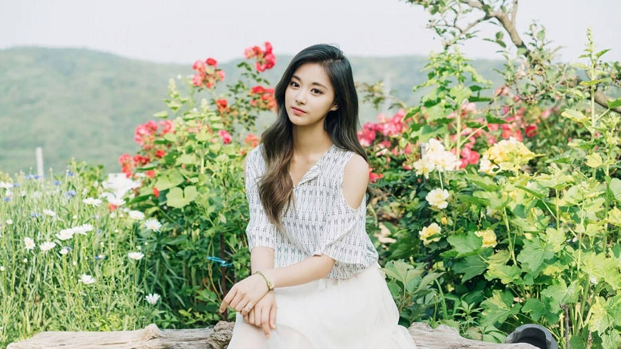 Tzuyu In A Flowery Garden Wallpaper