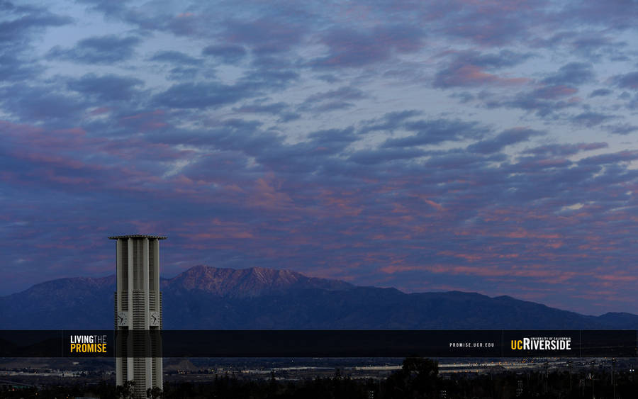 Ucr Bell Tower Under Cloudy Sky Wallpaper