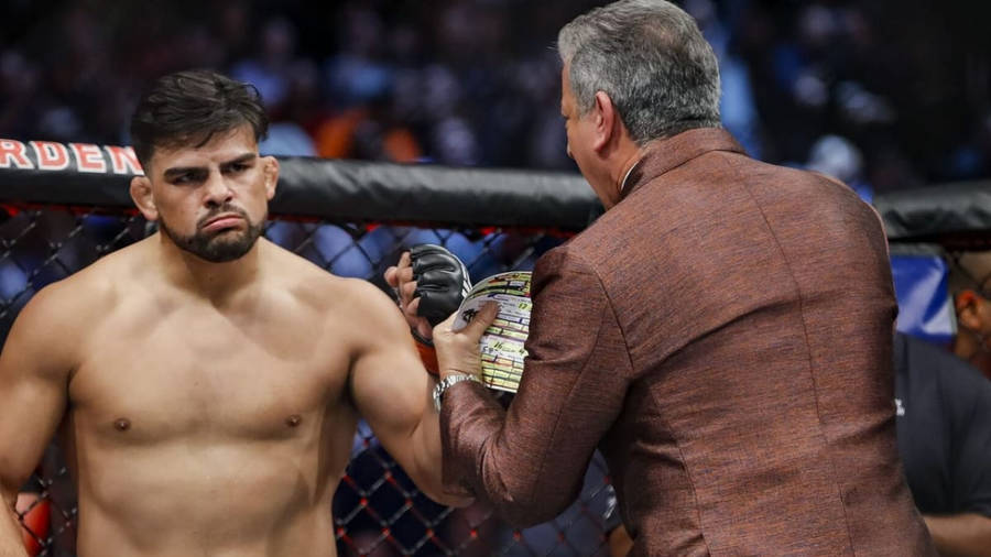 Ufc Star Kelvin Gastelum In Action Wallpaper