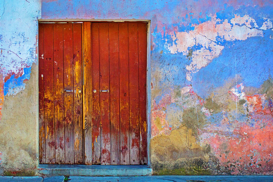 Unique Door In Rust Yellow Hues Wallpaper