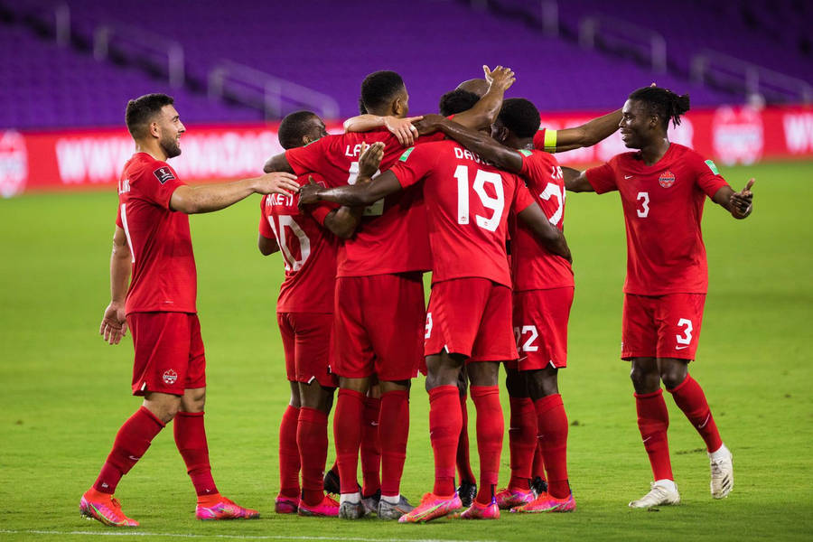 United We Stand - Canada National Football Team Embrace In Huddle Wallpaper