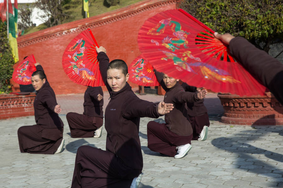 Unleashing Strength And Fearlessness: Kung Fu Nuns In Kathmandu, Nepal Wallpaper