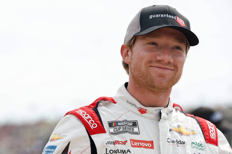 Up-close Look At Nascar Driver Tyler Reddick Flashing A Cheeky Smile Wallpaper