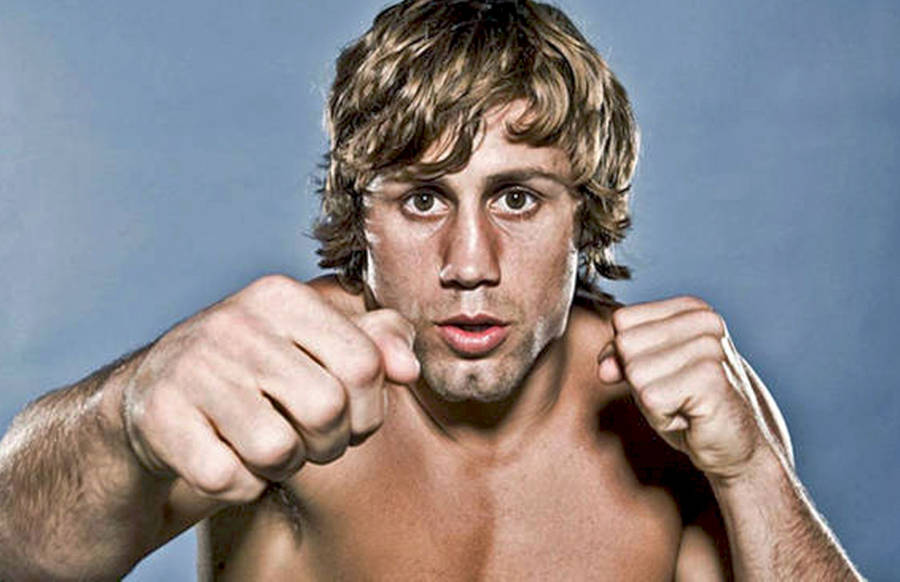 Urijah Faber Posing And Punching Wallpaper