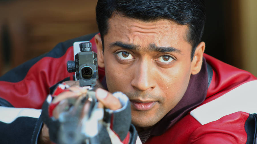 Vaaranam Aayiram Surya Aiming A Gun Wallpaper