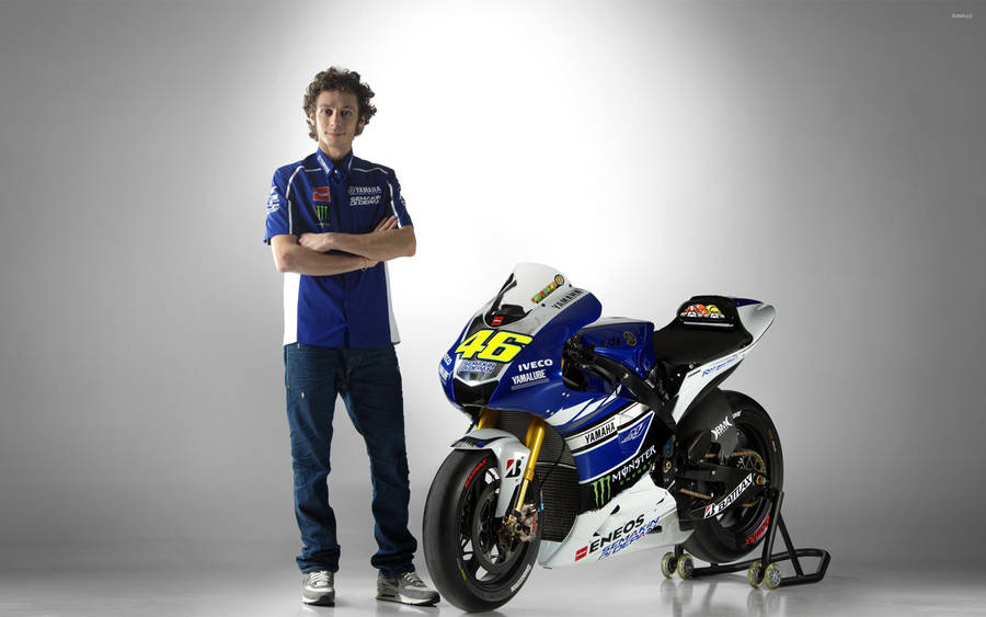 Valentino Rossi In Action During A Yamaha Team Race. Wallpaper