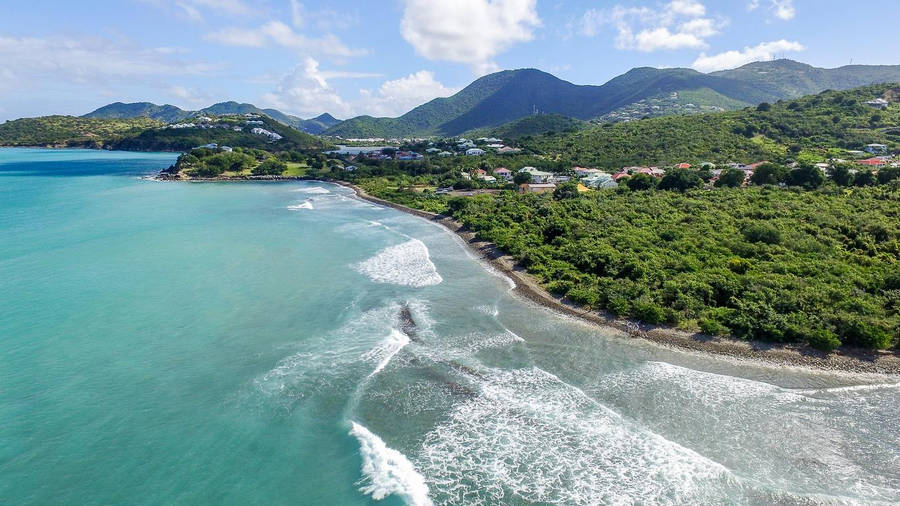 Vast Beach Waves At Sint Maarten's Shoreline Wallpaper