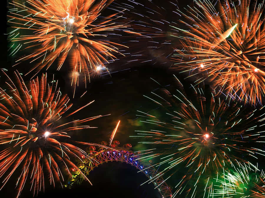 Vibrant_ Fireworks_ Display_ Over_ Bridge Wallpaper