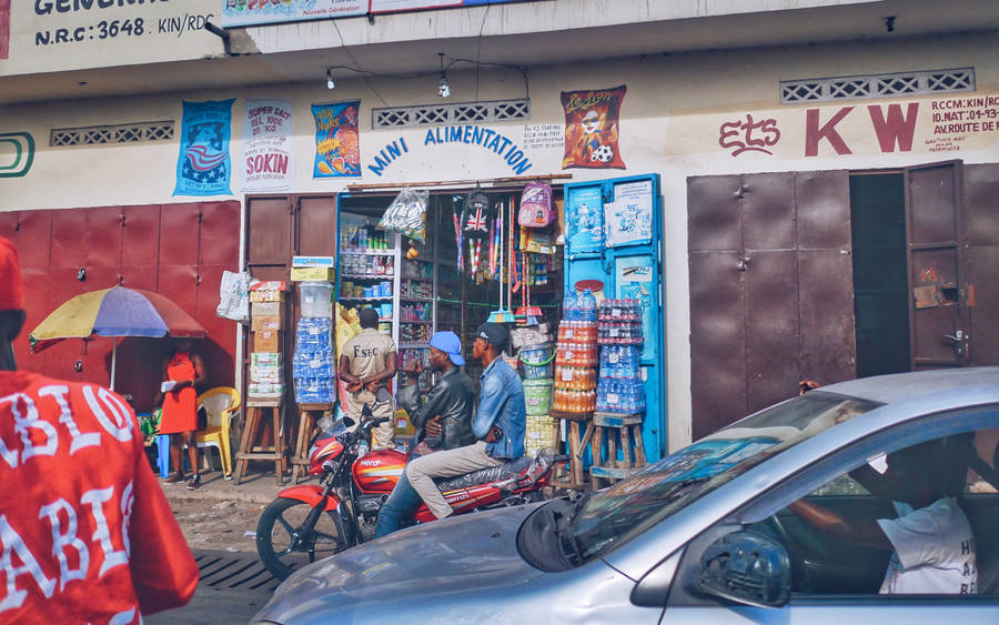 Vibrant Shop Scene In Kinshasa, Congo Wallpaper