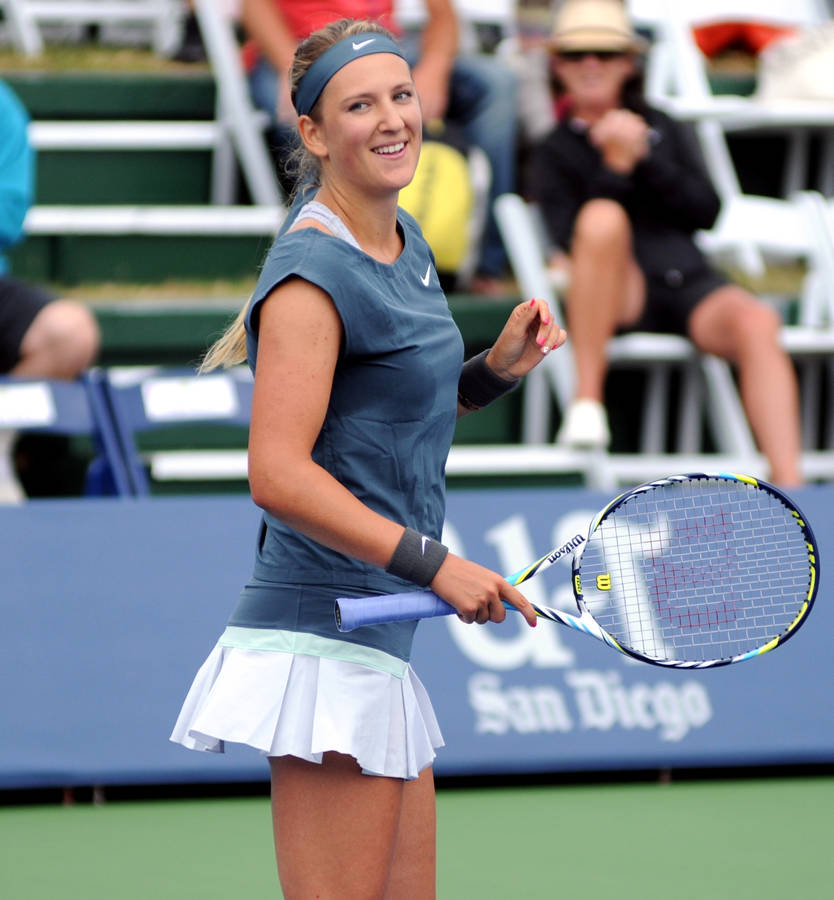 Victoria Azarenka Smiling In Gray Wallpaper