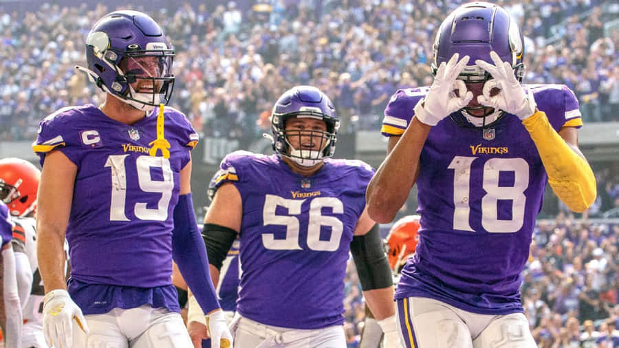 Vikings Players Celebrating Griddy Dance Wallpaper