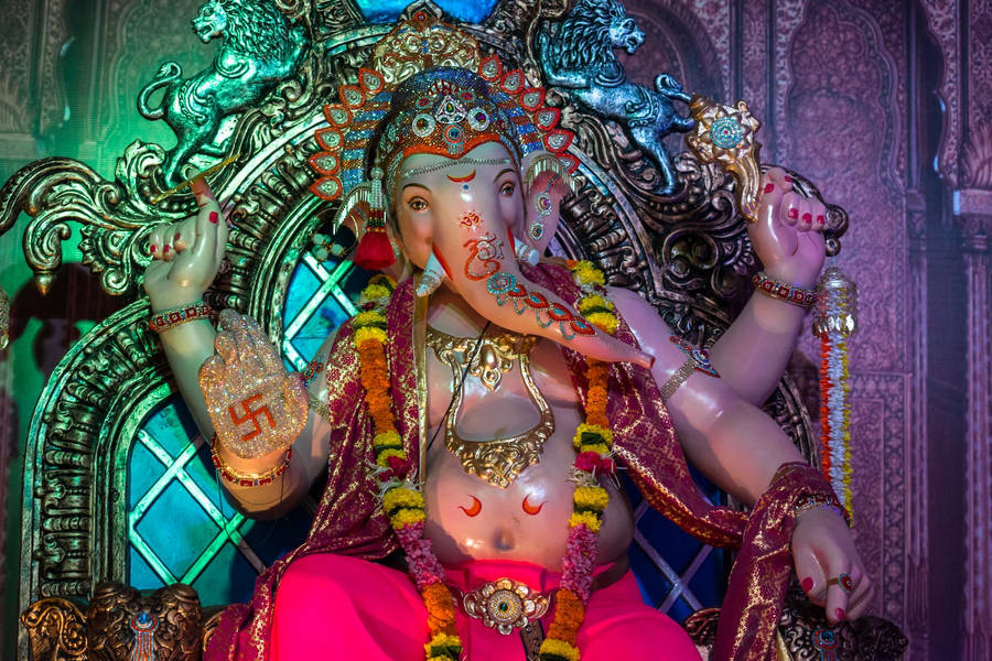 Vinayaka Sitting On A Throne Wallpaper