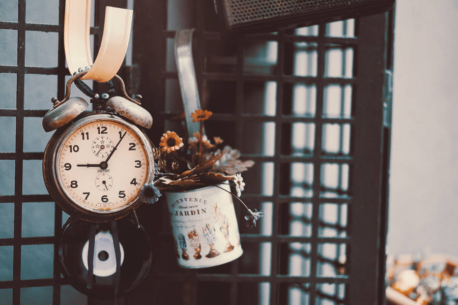 Vintage Clock With Flower Arrangement Wallpaper